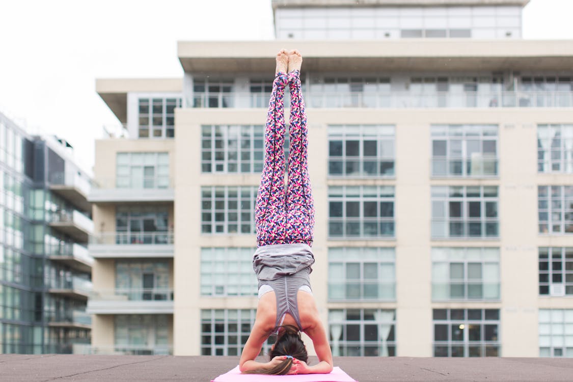 Woman performing a headstand yoga position