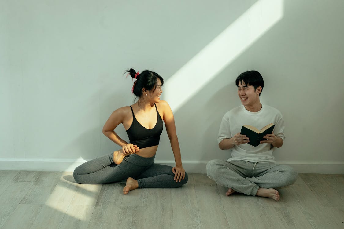 A happy man and woman smiling together, representing improved well-being through personalized hormone replacement therapy.