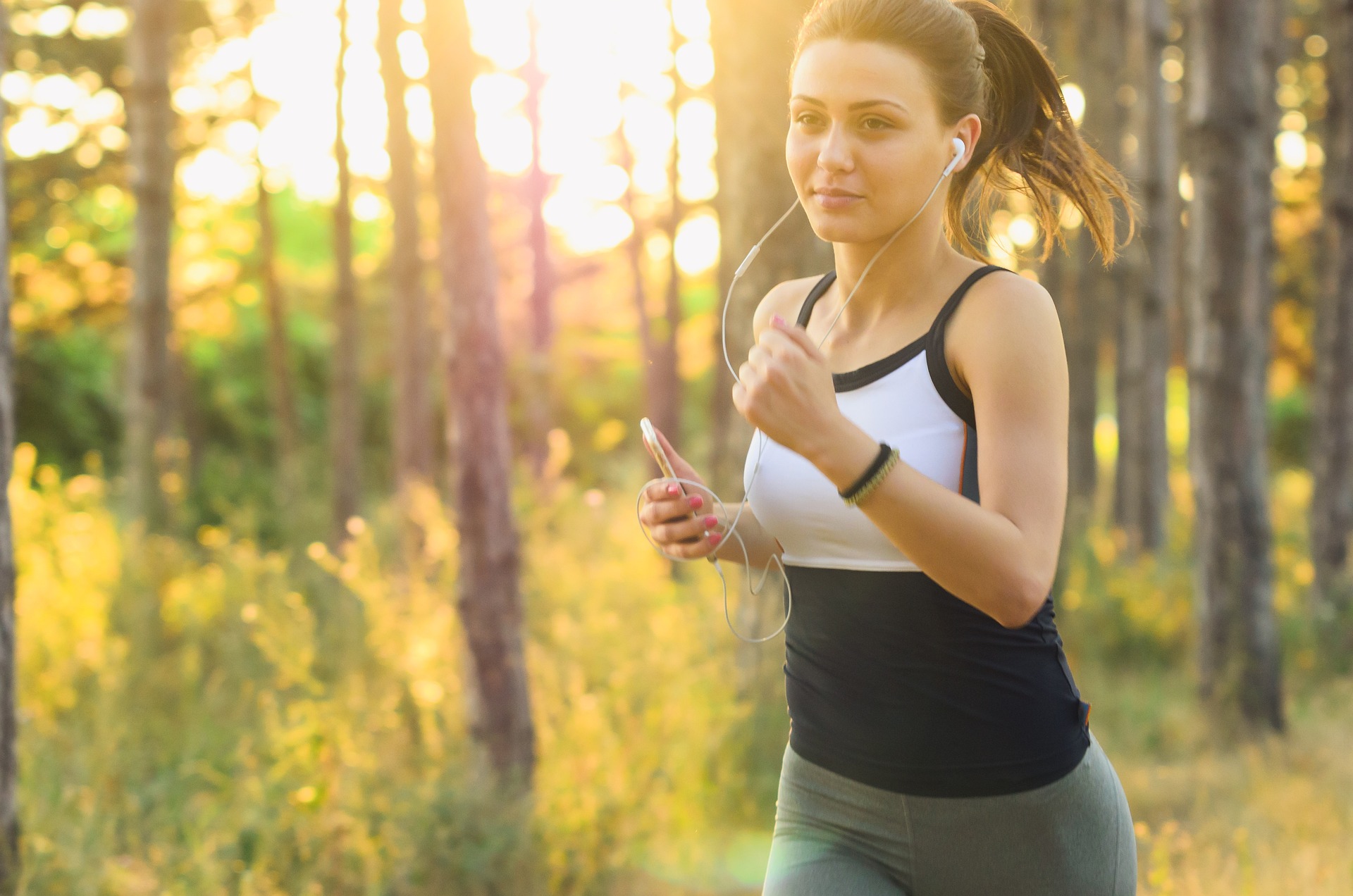 Woman jogging outdoors as part of a healthy daily fitness routine